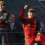 
              Ferrari driver Charles Leclerc of Monaco gestures as he gets onto the podium after winning the Australian Formula One Grand Prix in Melbourne, Australia, Sunday, April 10, 2022.Red Bull driver Sergio Perez, left, of Mexico was second. (AP Photo/Asanka Brendon Ratnayake)
            