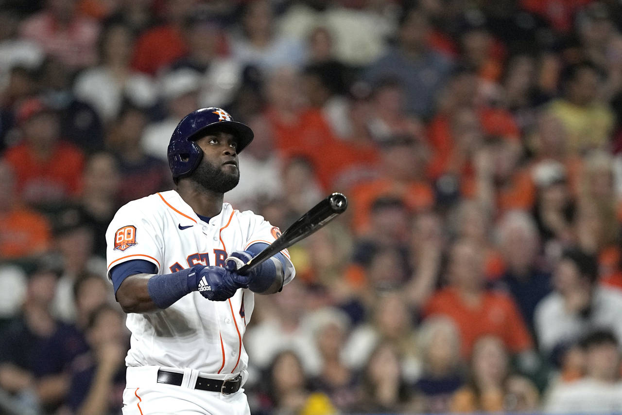 Houston Astros' Yordan Alvarez watches his two-run home run against the Los Angeles Angels during t...