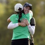 
              Jennifer Kupcho, facing camera, is hugged by fellow player Emma Talley on the18th hole after winning the LPGA Chevron Championship golf tournament Sunday, April 3, 2022, in Rancho Mirage, Calif. (AP Photo/Marcio Jose Sanchez)
            
