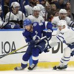 
              Tampa Bay Lightning center Steven Stamkos (91) moves the puck ahead of Toronto Maple Leafs right wing Ilya Mikheyev (65) during the first period of an NHL hockey game Thursday, April 21, 2022, in Tampa, Fla. (AP Photo/Chris O'Meara)
            