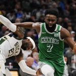 
              Boston Celtics' Jaylen Brown is fouled by Milwaukee Bucks' Wesley Matthews during the second half of an NBA basketball game Thursday, April 7, 2022, in Milwaukee. The Bucks won 127-121. (AP Photo/Morry Gash)
            