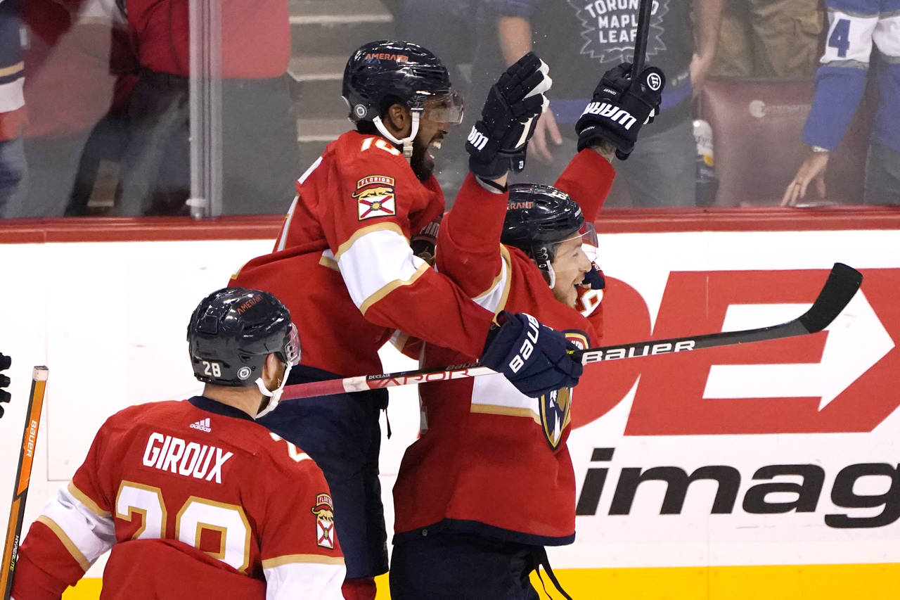 Florida Panthers left wing Anthony Duclair, left, celebrates with defenseman Brandon Montour, right...