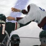 
              Colorado Avalanche's Logan O'Connor, right, has trouble finding Minnesota Wild's Brandon Duhaime (21) during a fight in the first period of an NHL hockey game Friday, April 29, 2022, in St. Paul, Minn. Both received fighting penalties. (AP Photo/Jim Mone)
            