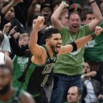 
              Boston Celtics forward Jayson Tatum (0) celebrates after making a layup at the buzzer to score and win Game 1 of an NBA basketball first-round Eastern Conference playoff series against the Brooklyn Nets, Sunday, April 17, 2022, in Boston. The Celtics won 115-114. (AP Photo/Steven Senne)
            