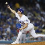 
              Los Angeles Dodgers starting pitcher Walker Buehler (21) throws during the first inning of a baseball game against the Cincinnati Reds in Los Angeles, Thursday, April 14, 2022. (AP Photo/Ashley Landis)
            