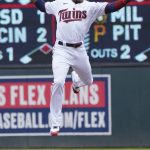 
              Minnesota Twins second baseman Jorge Polanco goes high for the throw on a successful steal by Detroit Tigers' Jonathan Schoop in the fourth inning of a baseball game, Thursday, April 28, 2022, in Minneapolis. (AP Photo/Jim Mone)
            