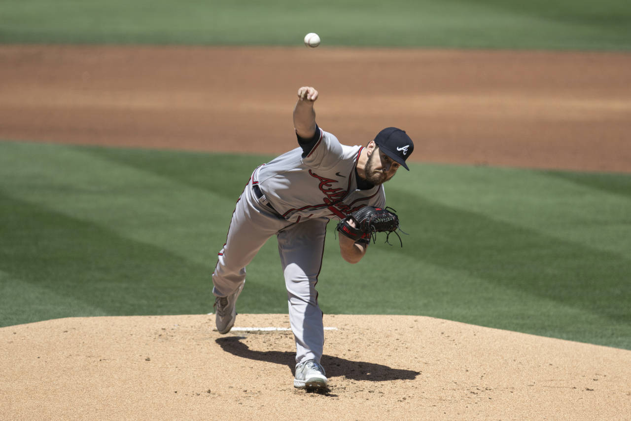 Atlanta Braves starting pitcher Ian Anderson throws during the first inning of a baseball game agai...