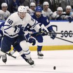 
              Toronto Maple Leafs left wing Michael Bunting (58) handles the puck during the first period of an NHL hockey game against the Tampa Bay Lightning, Monday, April 4, 2022, in Tampa, Fla. (AP Photo/Jason Behnken)
            