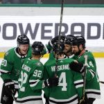 
              Dallas Stars defenseman Ryan Suter (20) celebrates his 100th career goal against the New Jersey Devils with center Vladislav Namestnikov (92), defenseman Miro Heiskanen (4), center Tyler Seguin (91) and left wing Jamie Benn (14) during the second period of an NHL hockey game in Dallas, Saturday, April 9, 2022. (AP Photo/Michael Ainsworth)
            