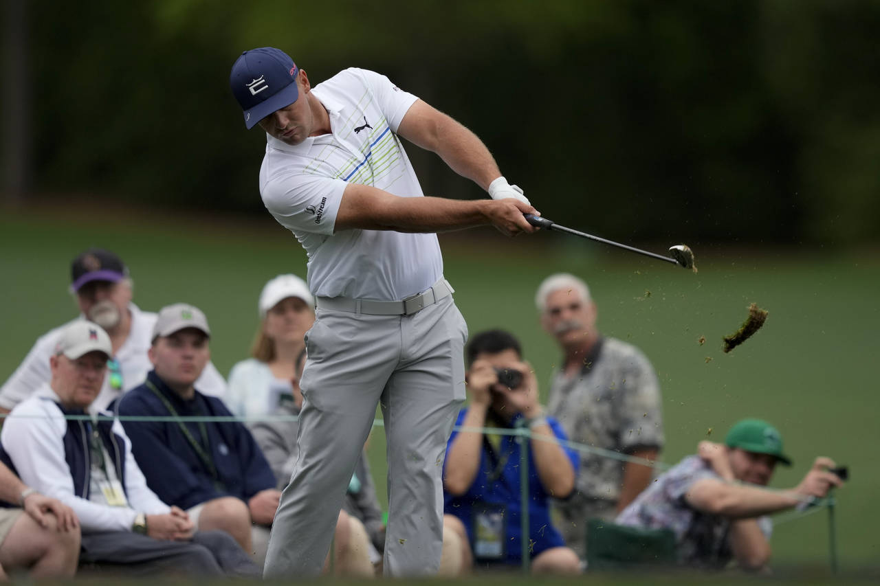 Bryson DeChambeau hits on the 12th tee during a practice round for the Masters golf tournament on W...