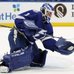 
              Tampa Bay Lightning goaltender Brian Elliott (1) makes a save on a shot by the Buffalo Sabres during the first period of an NHL hockey game Sunday, April 10, 2022, in Tampa, Fla. (AP Photo/Chris O'Meara)
            
