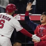 
              Los Angeles Angels' Anthony Rendon, left, is congratulated by Shohei Ohtani after hitting a two-run home run during the seventh inning of a baseball game against the Baltimore Orioles Friday, April 22, 2022, in Anaheim, Calif. (AP Photo/Mark J. Terrill)
            