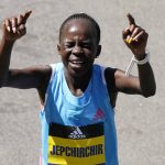 
              Peres Jepchirchir, of Kenya, reacts after winning the women's division of the Boston Marathon, Monday, April 18, 2022, in Boston. (AP Photo/Charles Krupa)
            