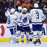 
              Toronto Maple Leafs' Wayne Simmonds, second from left, celebrates his goal with Colin Blackwell (11), Justin Holl (3), TJ Brodie (78) and Nicholas Abruzzese, obscured, during the second period of the team's NHL hockey game against the Philadelphia Flyers, Saturday, April 2, 2022, in Philadelphia. (AP Photo/Derik Hamilton)
            
