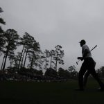 
              Tiger Woods walks to the 14th tee during his morning practice round for the Masters at Augusta National Golf Club in Augusta, Ga., Wednesday, April 6, 2022. (Curtis Compton/Atlanta Journal-Constitution via AP)
            