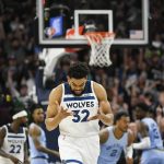 
              Minnesota Timberwolves center Karl-Anthony Towns reacts after scoring against the Memphis Grizzlies early in the first half in Game 4 of an NBA basketball first-round playoff series Saturday, April 23, 2022, in Minneapolis. (AP Photo/Craig Lassig)
            
