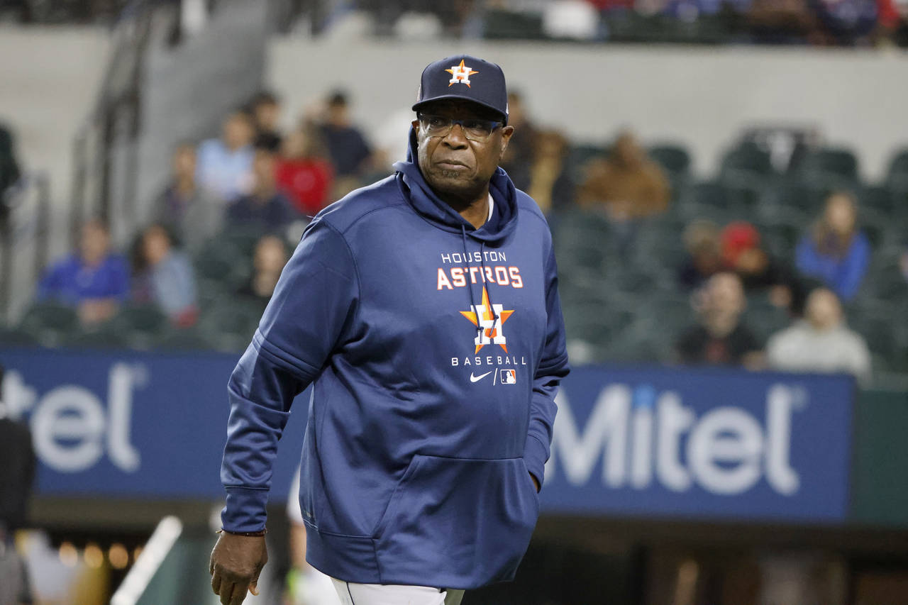 Houston Astros manager Dusty Baker Jr. (12) walks off the field after making a pitching change as t...