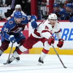 
              Carolina Hurricanes center Martin Necas (88) and Colorado Avalanche right wing Mikko Rantanen (96) chase the puck during the third period of an NHL hockey game Saturday, April 16, 2022, in Denver. (AP Photo/Jack Dempsey)
            