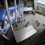 
              Fans arrive early for the Kansas City Royals' home opener against the Cleveland Guardians in a baseball game, Thursday, April 7, 2022 in Kansas City, Mo. (AP Photo/Reed Hoffmann)
            