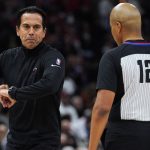 
              Miami Heat coach Erik Spoelstra, left, questions referee CJ Washington about a foul called on guard Kyle Lowry'during the first half of the team's NBA basketball game against the Chicago Bulls in Chicago, Saturday, April 2, 2022. (AP Photo/Nam Y. Huh)
            