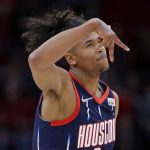 
              Houston Rockets guard Jalen Green celebrates a 3-point shot against the Sacramento Kings during the first half of an NBA basketball game Friday, April 1, 2022, in Houston. (AP Photo/Michael Wyke)
            
