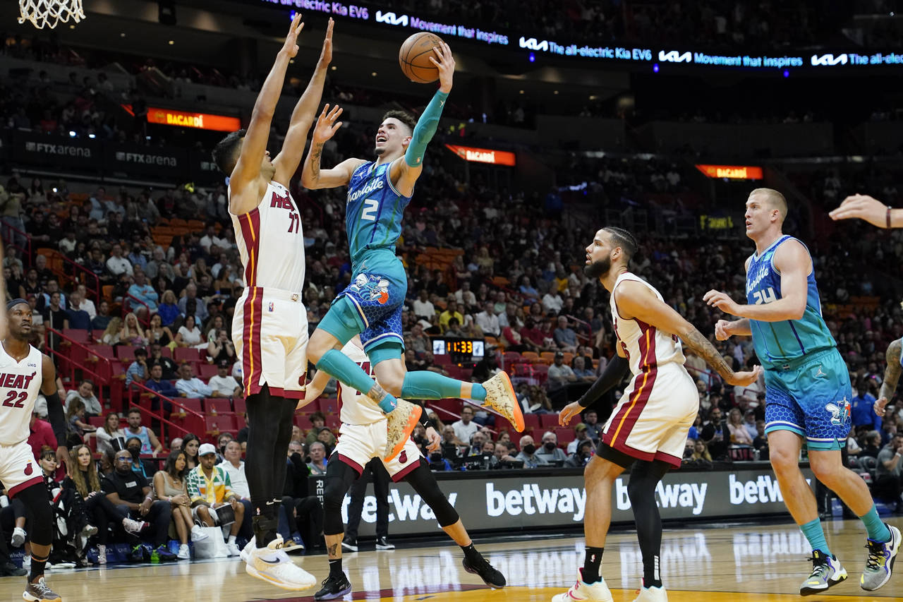 Charlotte Hornets guard LaMelo Ball (2) goes to the basket as Miami Heat center Omer Yurtseven (77)...
