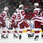 
              Detroit Red Wings' Tyler Bertuzzi (59), center, celebrates his empty net goal with Moritz Seider (53), second from right, during the third period of an NHL hockey game against the New Jersey Devils in Newark, N.J., Friday, April 29, 2022. The Red Wings defeated the Devils 5-3. (AP Photo/Seth Wenig)
            