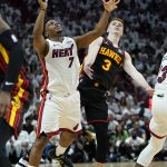 
              Miami Heat guard Kyle Lowry (7) is fouled by Atlanta Hawks guard Kevin Huerter (3) during the first half of Game 2 of an NBA basketball first-round playoff series, Tuesday, April 19, 2022, in Miami. (AP Photo/Lynne Sladky)
            