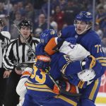 
              Buffalo Sabres right wing Tage Thompson (72) tries to pull New York Islanders left wing Matt Martin (17) off of left wing Jeff Skinner (53) during the third period of an NHL hockey game on Saturday, April 23, 2022, in Buffalo, N.Y. (AP Photo/Joshua Bessex)
            