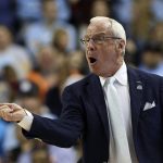 
              FILE - North Carolina head coach Roy Williams yells during the first half of an NCAA college basketball game against Virginia Tech at the Atlantic Coast Conference tournament in Greensboro, N.C., March 10, 2020. North Carolina and Kansas are two of the most storied college basketball programs ever, yet they rarely play despite a share history that includes coaches Williams, Dean Smith and Larry Brown. (AP Photo/Ben McKeown, File)
            