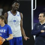 
              Duke head coach Mike Krzyzewski talks with Mark Williams during practice for the men's Final Four NCAA college basketball tournament, Friday, April 1, 2022, in New Orleans. (AP Photo/David J. Phillip)
            