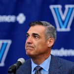 
              Jay Wright grimaces while speaking at a news conference about his resignation as NCAA college basketball coach at Villanova, in Villanova, Pa., Friday, April 22, 2022. (AP Photo/Matt Rourke)
            