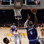 
              Los Angeles Lakers forward LeBron James (6) shoots during the first half of an NBA basketball game against the New Orleans Pelicans in Los Angeles, Friday, April 1, 2022. (AP Photo/Ashley Landis)
            