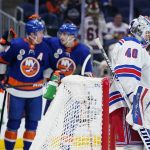 
              New York Rangers goaltender Alexandar Georgiev (40) stands in front of the goal as the New York Islanders celebrate a goal by Brock Nelson during the second period of an NHL hockey game Thursday, April 21, 2022, in Elmont, N.Y. (AP Photo/Frank Franklin II)
            