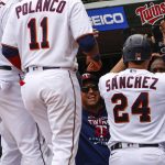 
              Minnesota Twins' Gary Sanchez (24) is celebrated by his team after hitting a grand slam against the Seattle Mariners during the first inning of a baseball game, Sunday, April 10, 2022, in Minneapolis. (AP Photo/Nicole Neri)
            