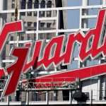 
              Workers finish installing the Cleveland Guardians sign above the scoreboard at Progressive Field, Thursday, March 17, 2022, in Cleveland. (AP Photo/Ron Schwane)
            