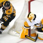 
              Boston Bruins' Brad Marchand (63) can't get a wraparound past Pittsburgh Penguins goaltender Casey DeSmith during the first period of an NHL hockey game in Pittsburgh, Thursday, April 21, 2022. (AP Photo/Gene J. Puskar)
            