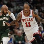 
              Chicago Bulls' DeMar DeRozan tries to get past Milwaukee Bucks' Jevon Carter during the second half of Game 5 of an NBA basketball first-round playoff series Wednesday, April 27, 2022, in Milwaukee. The Bucks won 116-100 to win the series. (AP Photo/Morry Gash)
            