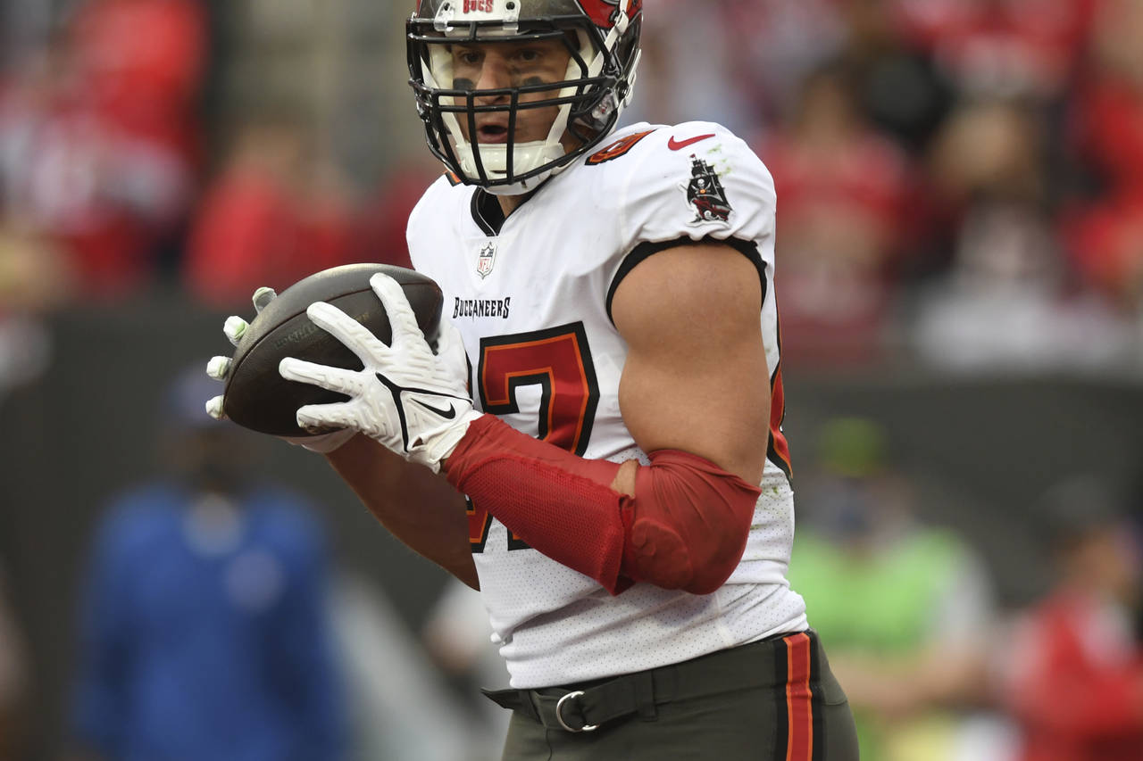 FILE - Tampa Bay Buccaneers tight end Rob Gronkowski catches a touchdown pass against the Philadelp...