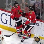 
              Chicago Blackhawks right wing Taylor Raddysh, left, celebrates with defenseman Seth Jones after scoring a goal during the second period of an NHL hockey game against the San Jose Sharks in Chicago, Thursday, April 14, 2022. (AP Photo/Nam Y. Huh)
            