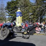 
              The men's wheelchair division breaks from the starting line of the 126th Boston Marathon, Monday, April 18, 2022, in Hopkinton, Mass. (AP Photo/Mary Schwalm)
            