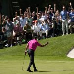 
              Tiger Woods pumps his fist after a birdie putt on the 16th green during the first round at the Masters golf tournament on Thursday, April 7, 2022, in Augusta, Ga. (AP Photo/David J. Phillip)
            