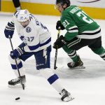 
              Tampa Bay Lightning left wing Alex Killorn (17) takes control of the puck next to Dallas Stars left wing Jason Robertson (21) during the first period of an NHL hockey game in Dallas, Tuesday, April 12, 2022. (AP Photo/LM Otero)
            