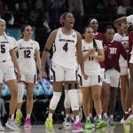 
              The South Carolina bench reacts after the second half of a college basketball game in the semifinal round of the Women's Final Four NCAA tournament Friday, April 1, 2022, in Minneapolis. South Carolina won 72-59 to advance to the finals. (AP Photo/Charlie Neibergall)
            