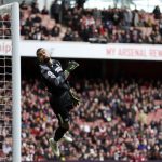 
              Brighton's goalkeeper Robert Sanchez receiving a goal from Arsenal's Martin Odegaard during the English Premier League soccer match between Arsenal and Brighton and Hove Albion at Emirates stadium in London, Saturday, April 9, 2022. (AP Photo/Ian Walton)
            