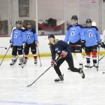 
              U.S. hockey player Haley Skarupa, front, demonstrates a drill during a hockey clinic presented by the Washington Capitals and the Professional Women's Hockey Players Association, Friday, March 4, 2022, in Arlington, Va. The growth of girls and women's hockey in the Washington area is still a work in progress almost two decades into a boom of youth participation in the sport credited to Alex Ovechkin and the NHL's Capitals.(AP Photo/Nick Wass)
            
