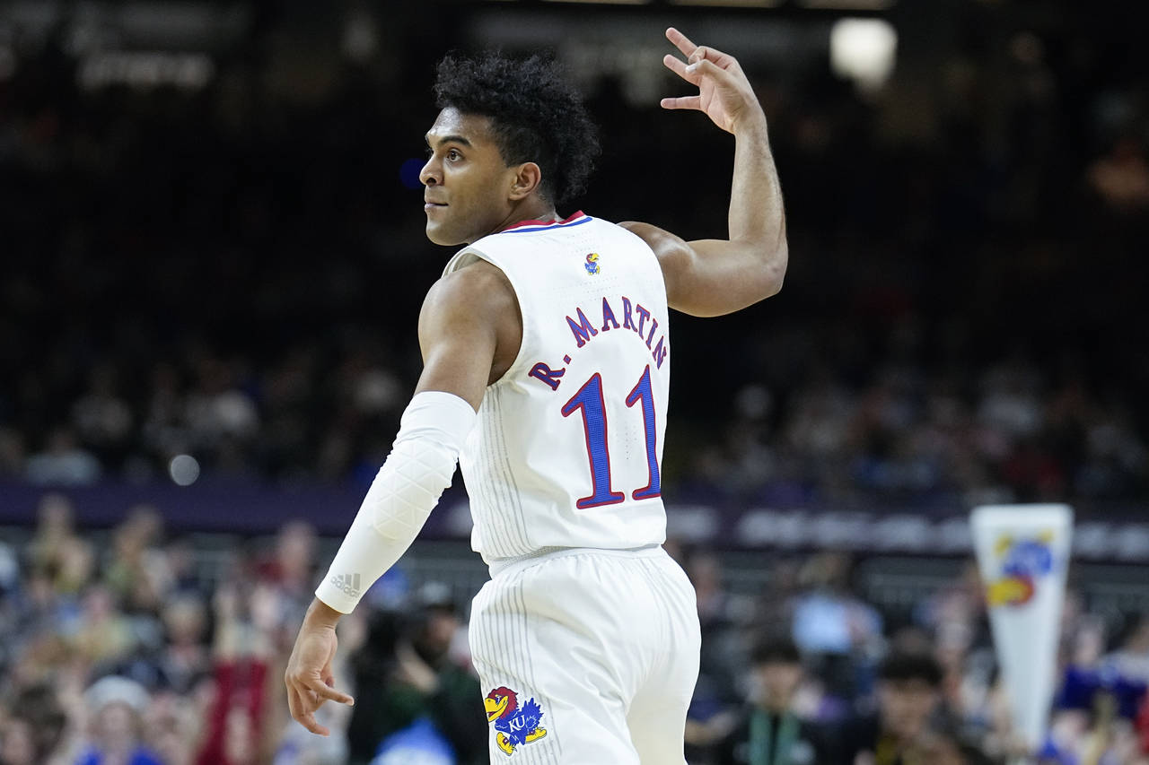 Kansas guard Remy Martin celebrates after scoring against Villanova during the first half of a coll...