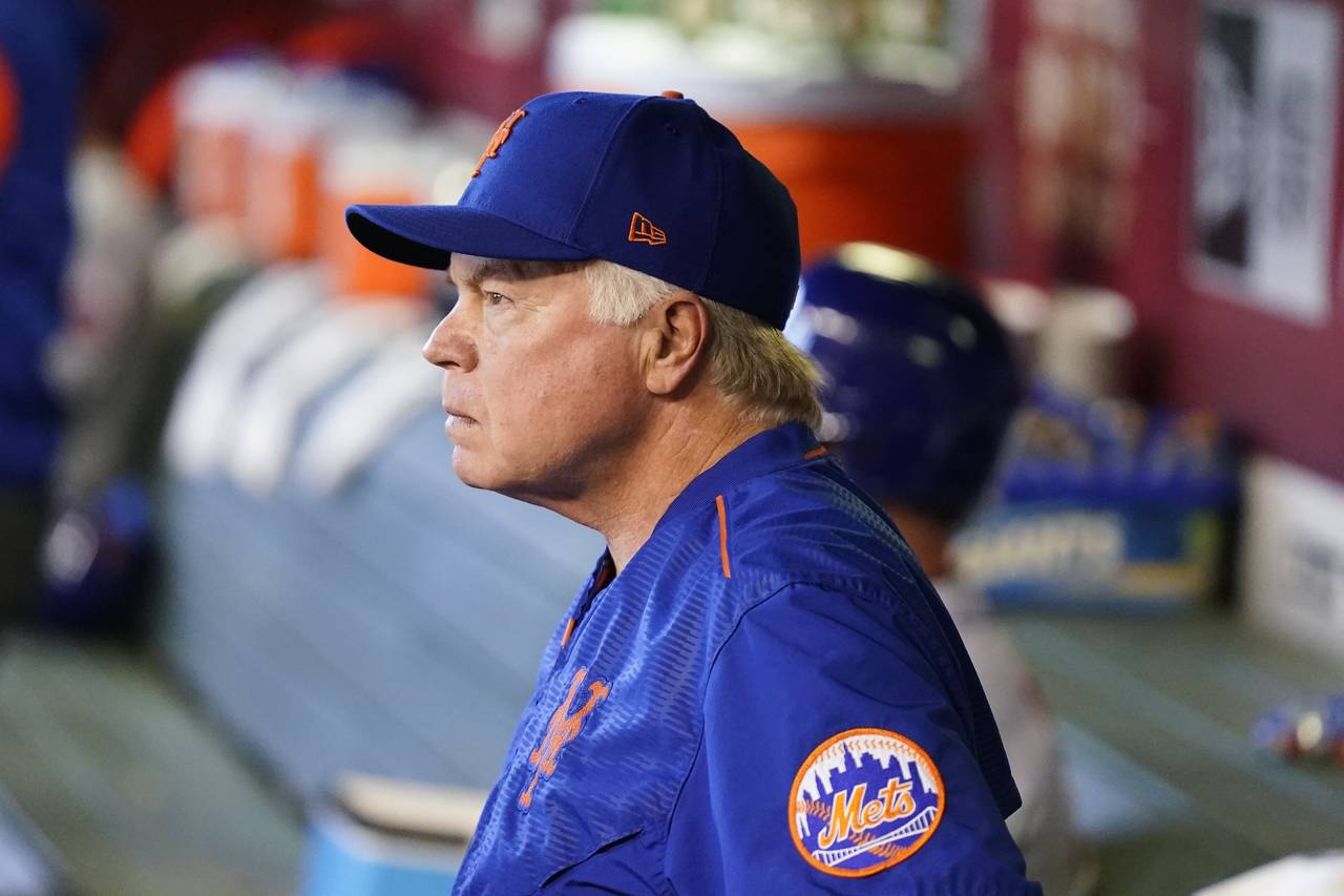 New York Mets manager Buck Showalter pauses in the dugout prior to a baseball game against the Ariz...