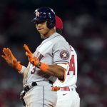 
              Houston Astros' Jeremy Pena (3) signals to the dugout after sliding safely into second base with a double during the seventh inning of the team's baseball game against the Los Angeles Angels on Friday, April 8, 2022, in Anaheim, Calif. (AP Photo/Marcio Jose Sanchez)
            