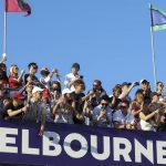 
              Spectators watch the Australian Formula One Grand Prix in Melbourne, Australia, Sunday, April 10, 2022. (AP Photo/Asanka Brendon Ratnayake)
            